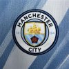 jersey Manchester City azzurro cielo con stemma del club in casa