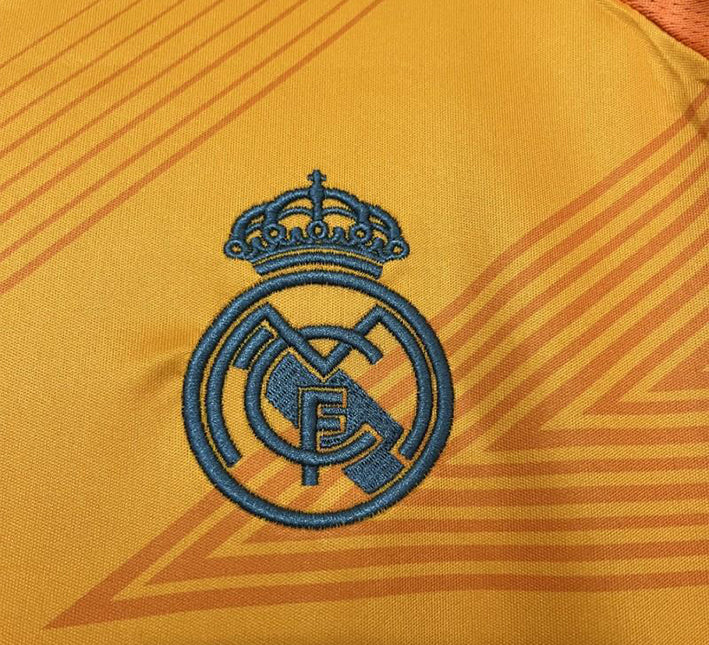 maillotrealmadridexterieurorangelogo.jpg Maglia Real Madrid Away 2024-2025 dettaglio tessuto