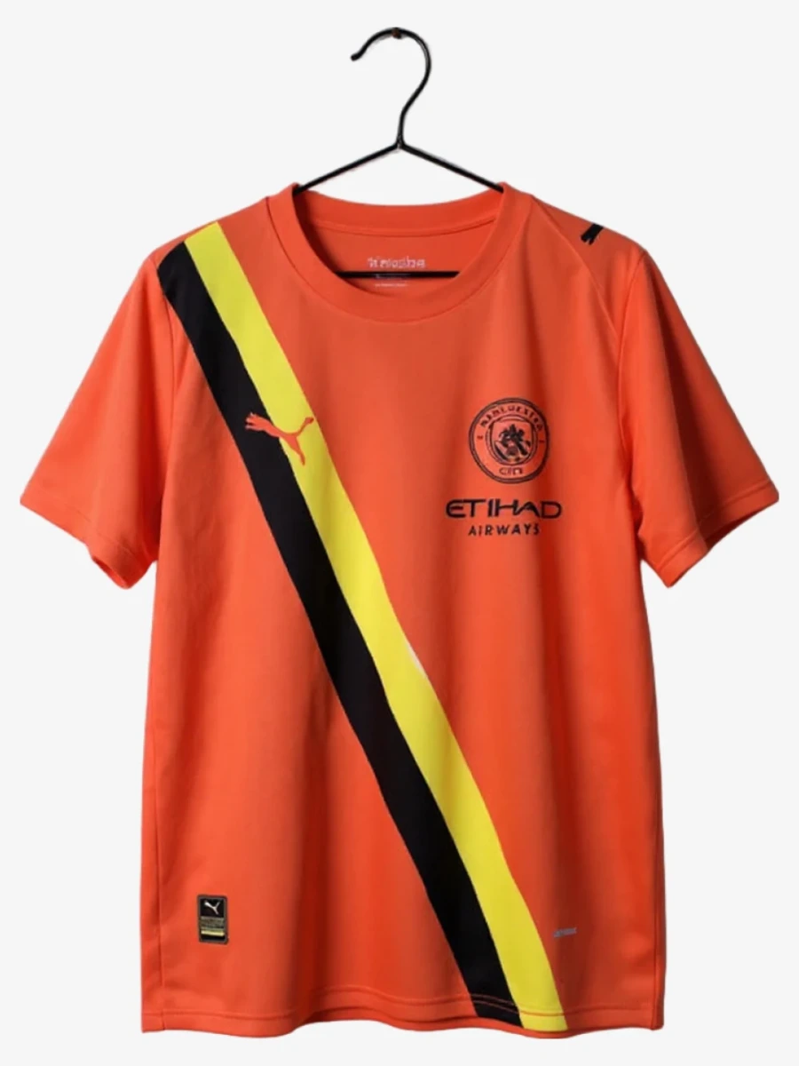 maillot-manchester-city-third-orange-2025-2026 studio v12 Maglia Manchester City Third Orange 2025-2026